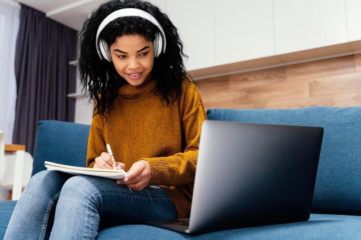 happy-teenage-girl-with-headphones-during-online-school_23-2148827455